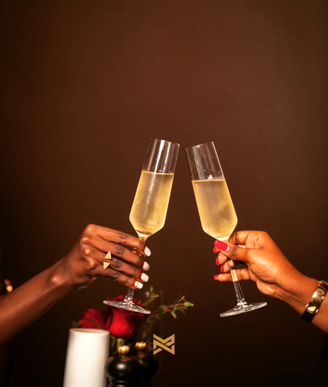 Two champagne flutes in a toast